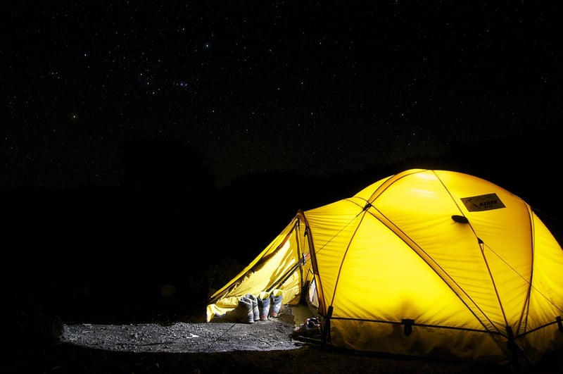Camping tents on the beach at sunset